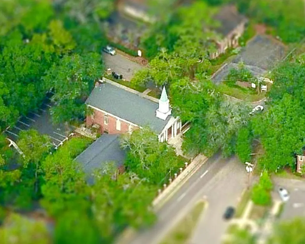 Aerial view of the Calvary OPC building among the trees
